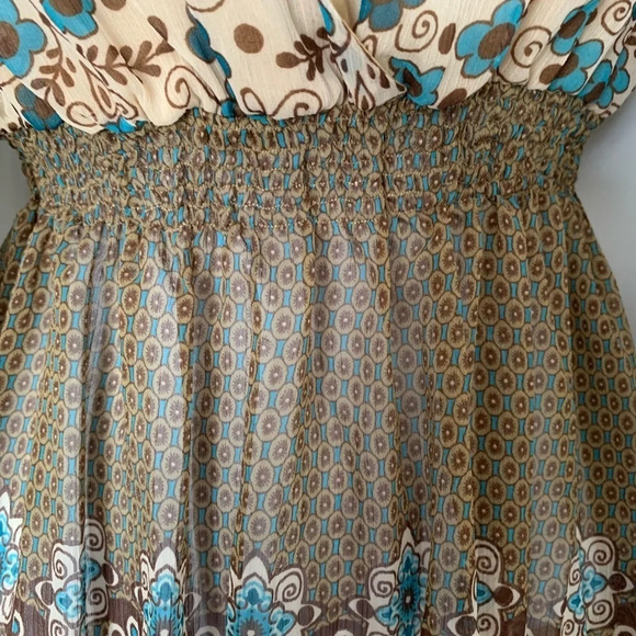 Definitely boho vibes.  Sheer long-sleeved top w/ elastic waist and tie at neck. - Picture 6 of 6